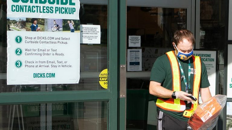 A DICK's Sporting Goods employee fulfills an omnichannel order